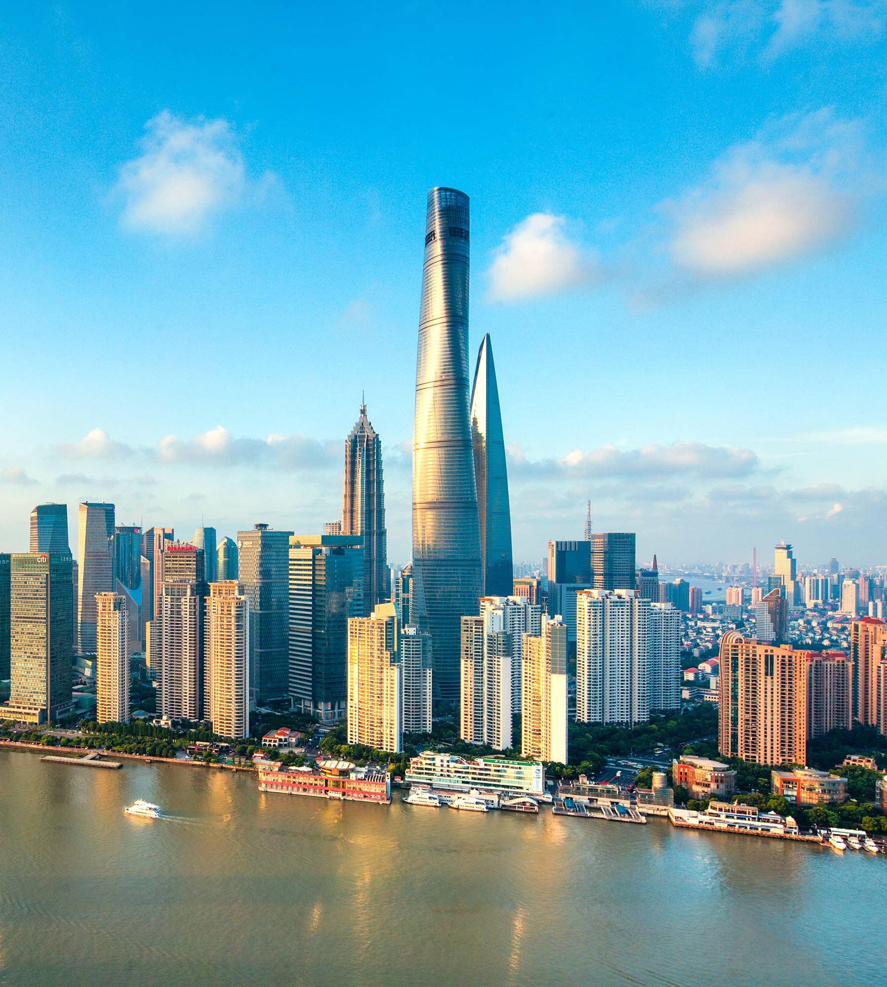 A city skyline with a body of water in the foreground.