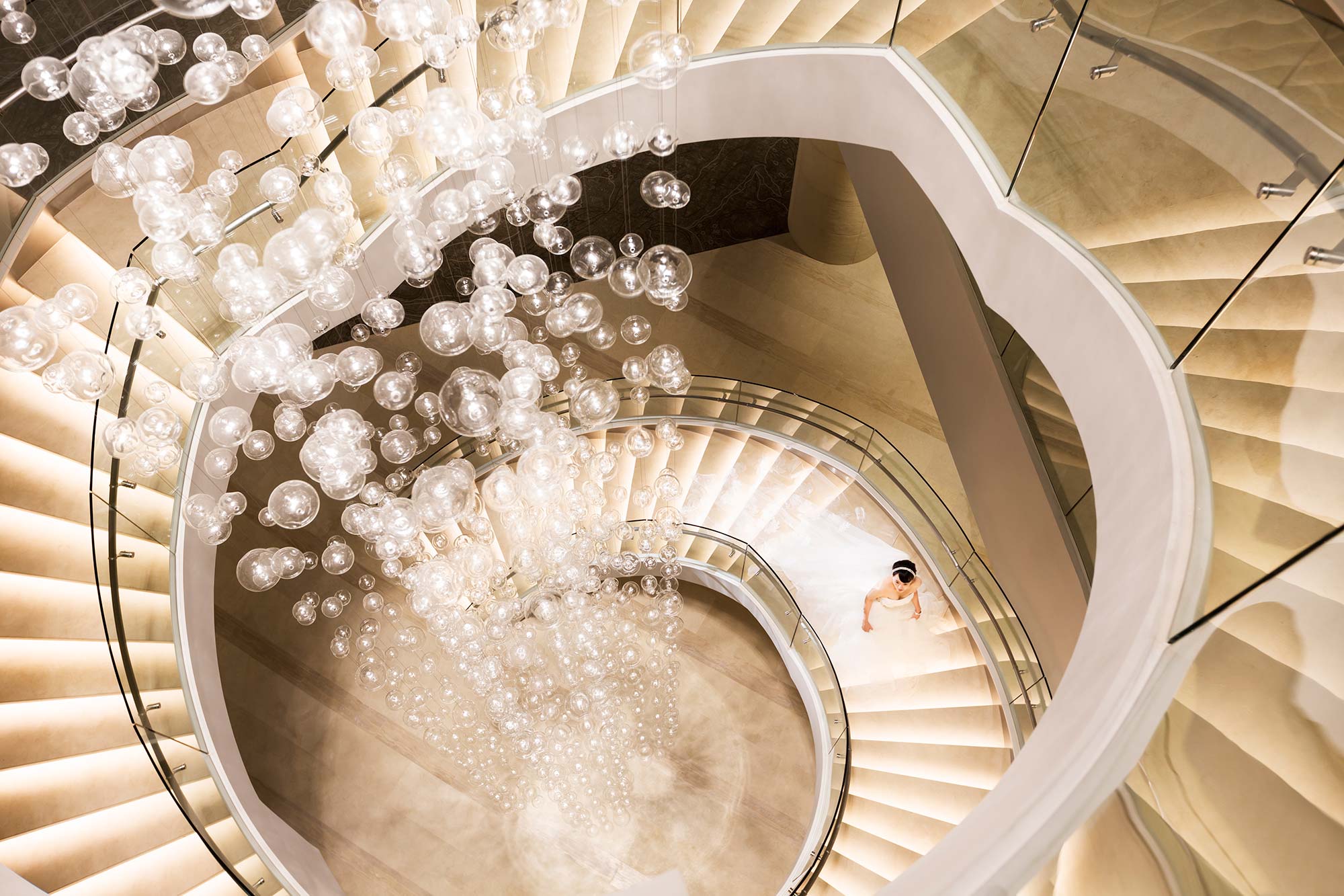 A person in a spiral staircase.