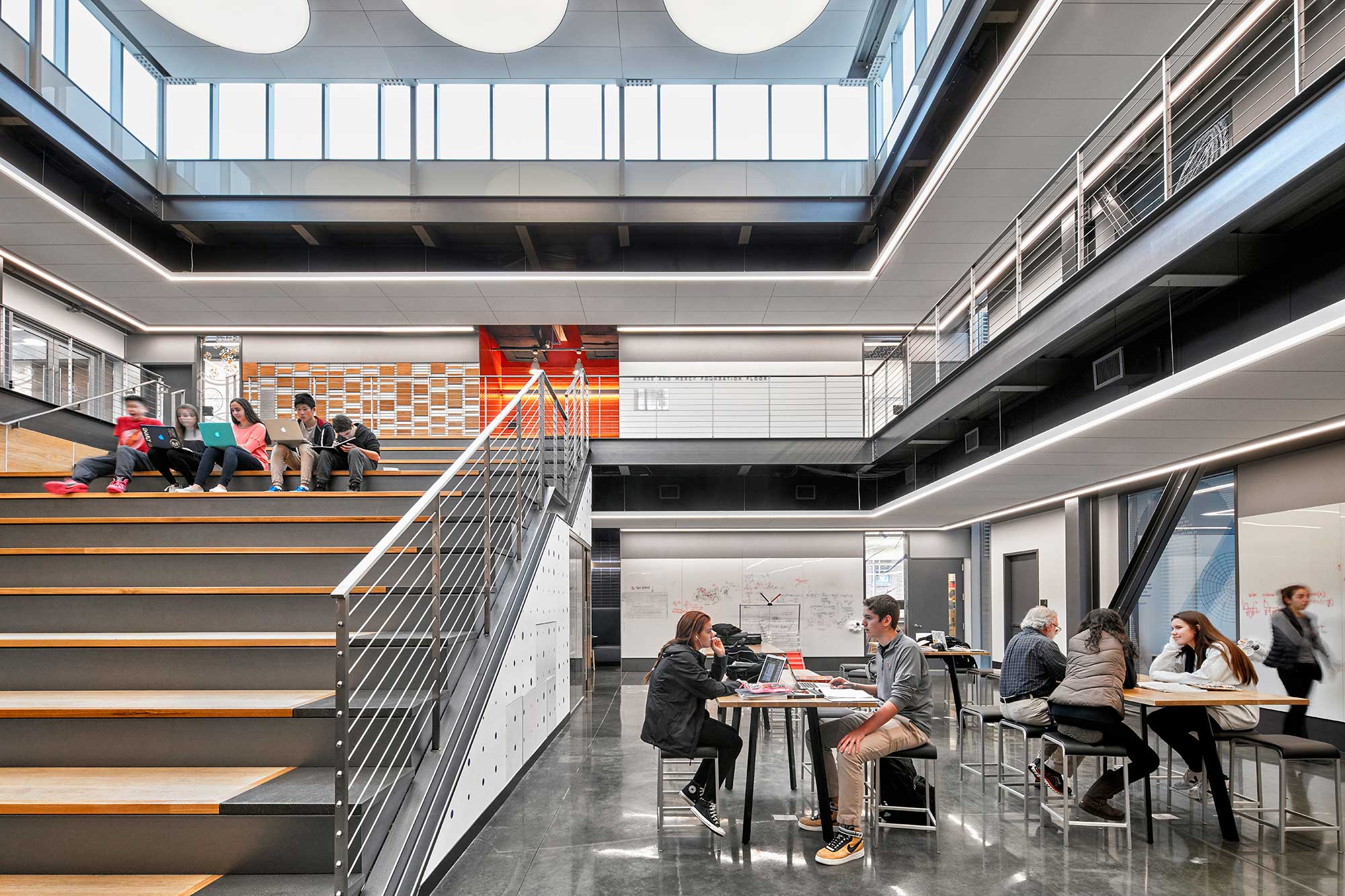 People sitting at tables in a building.