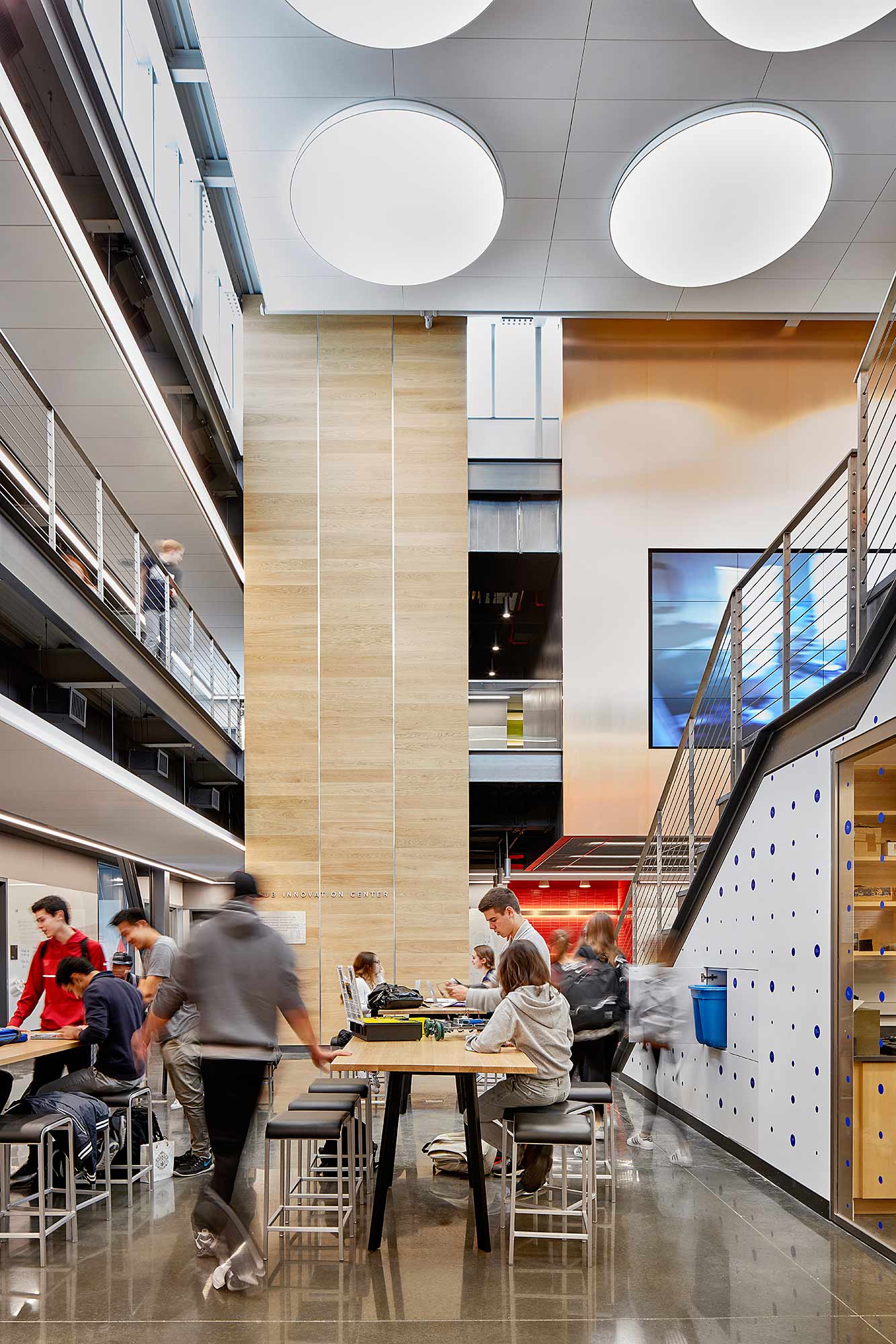 People sitting at tables in a building.