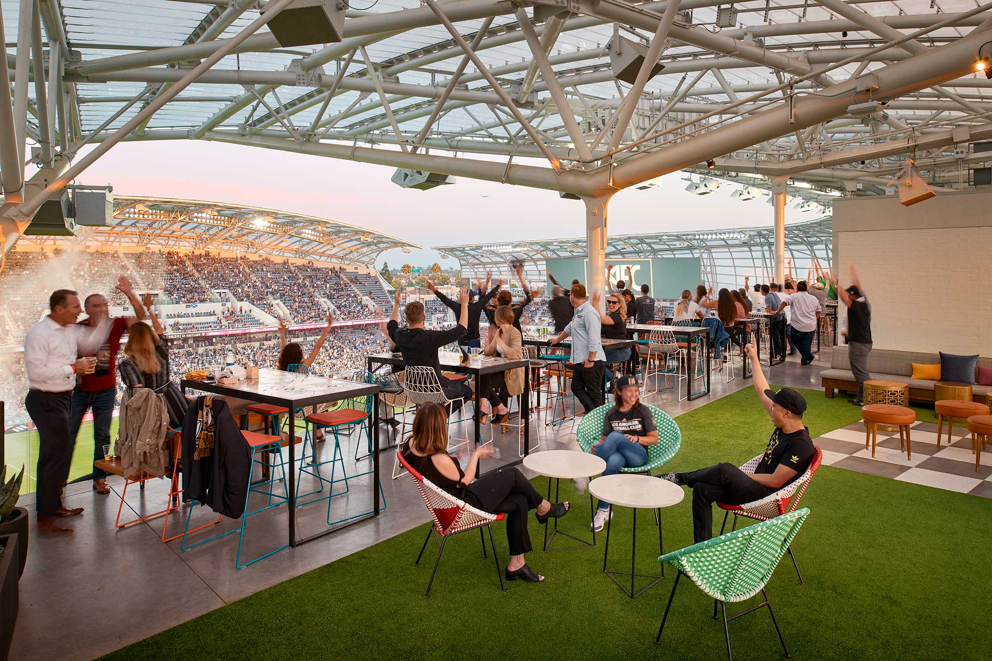 A group of people sitting at tables.