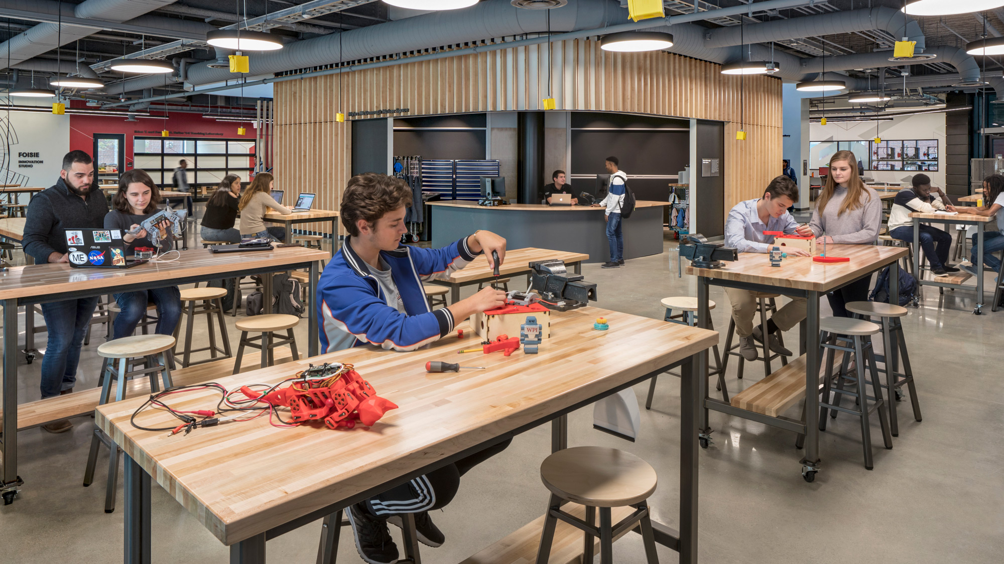 A group of people sitting at tables.