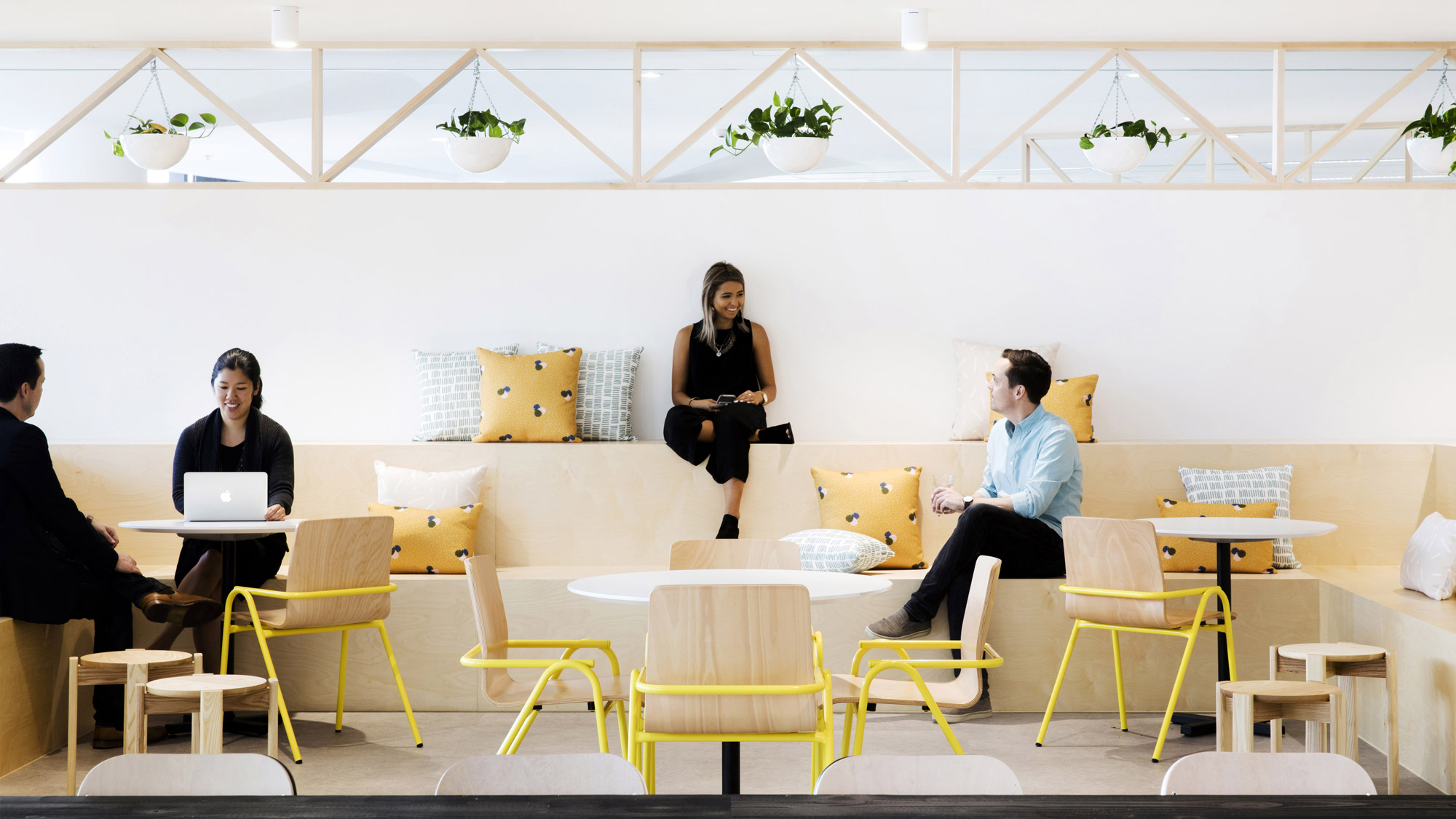 Employees sitting in a communal lounge space at the Yahoo7 offices in Sydney, Australia.