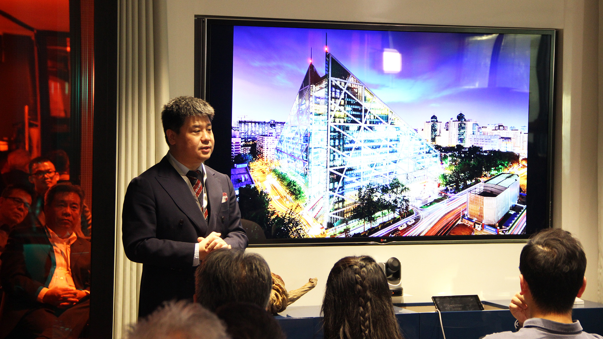 A panelist discusses the sustainable design for the Parkview Green Complex in China