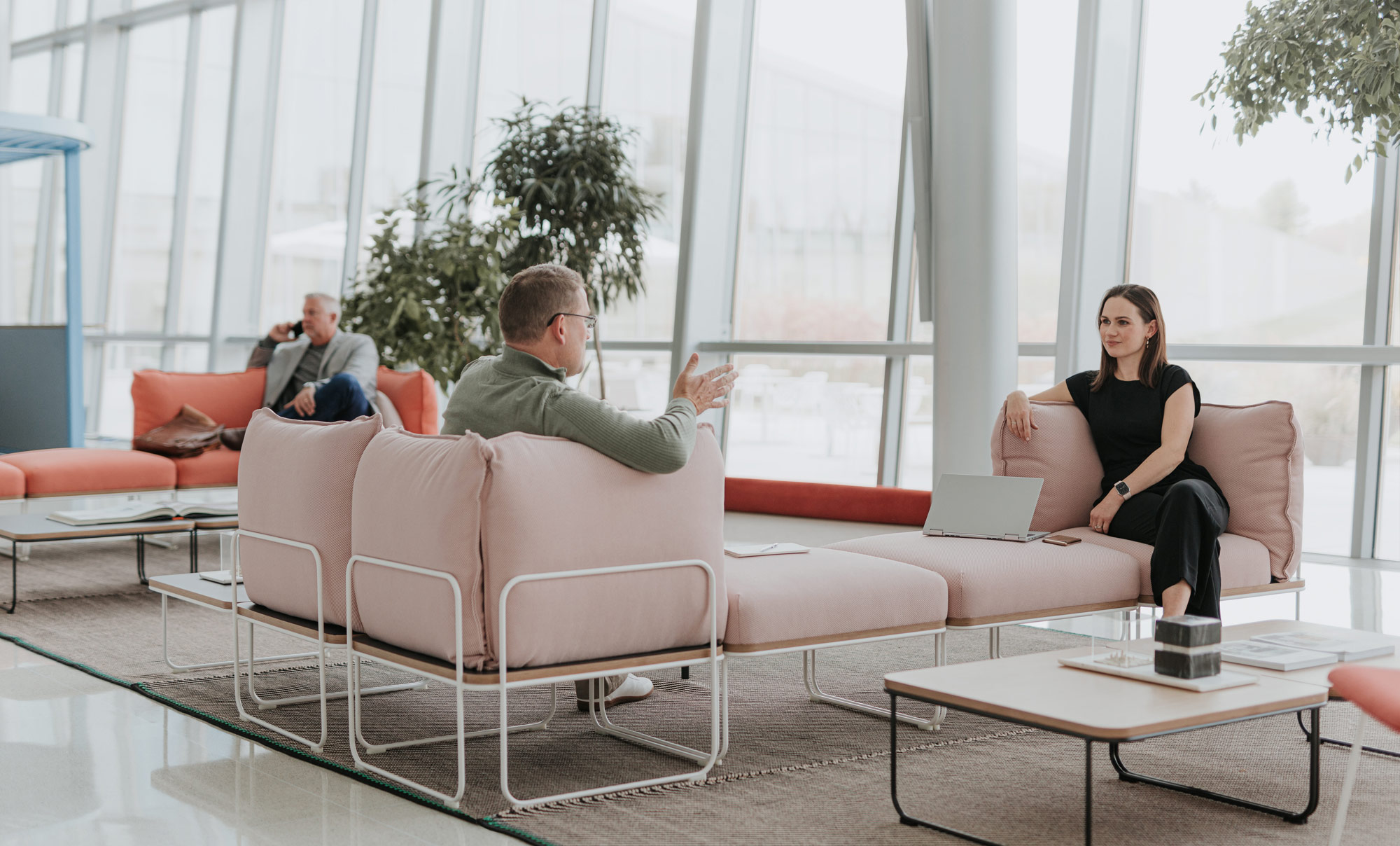 A group of people sitting in a living room.