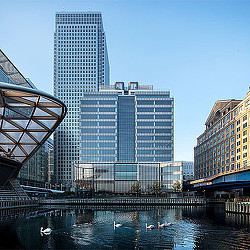 A group of buildings next to a body of water.
