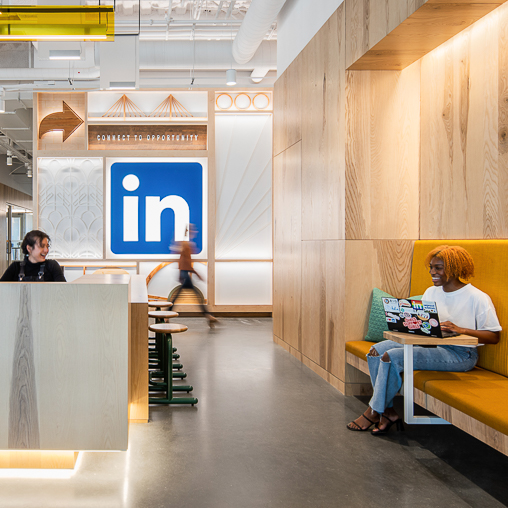 LinkedIn Omaha cafe-style seating with LinkedIn logo on wall.