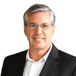 A man wearing a suit and tie.