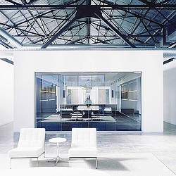 A room with a glass ceiling and a table and chairs.