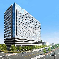 A large building with a parking lot.