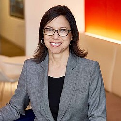 A woman wearing glasses.