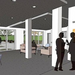 A room with glass doors and a person standing in front of it.