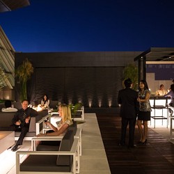 A group of people standing outside a building.
