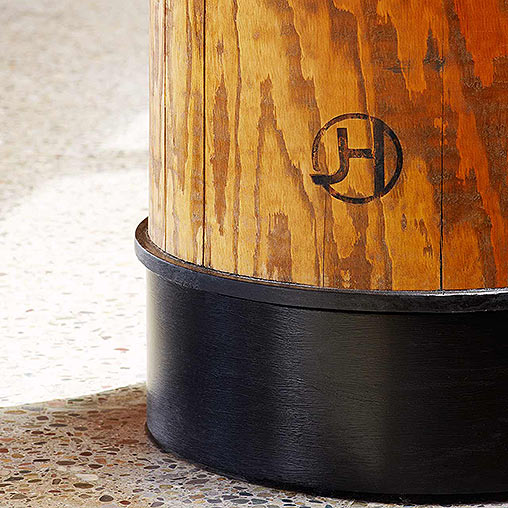 A black barrel with a wooden handle.