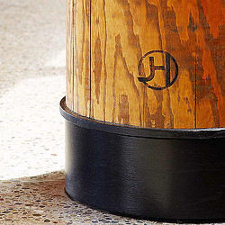 A black barrel with a wooden handle.