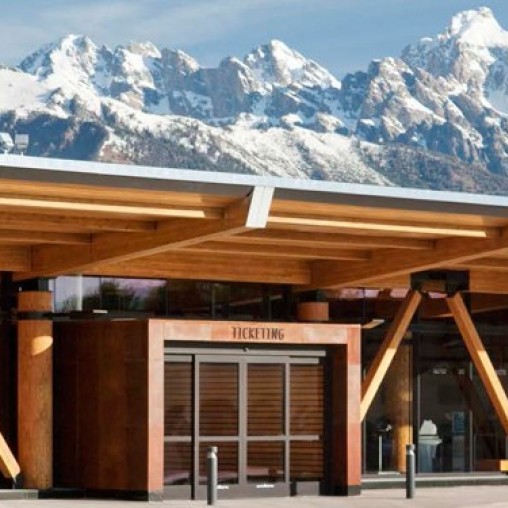 A building with a mountain in the background.