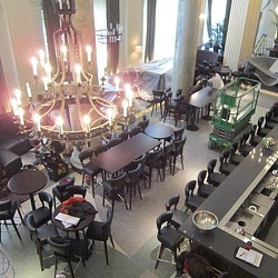 A room with tables and chairs.