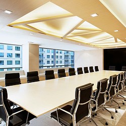 A conference room with a large table.