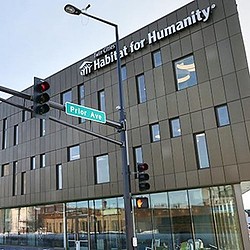 A street sign next to a traffic light.