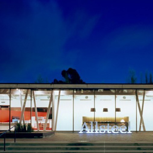 A large white building with a fire on top.