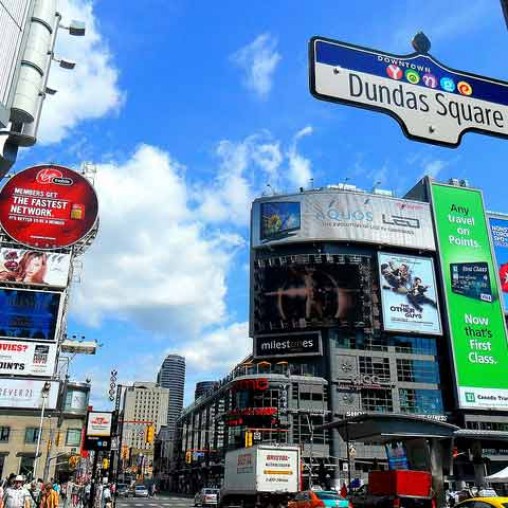 A city street with billboards.