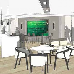 A classroom with tables and chairs.