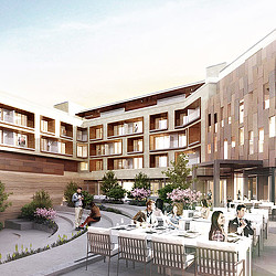 A group of people sitting outside a building.