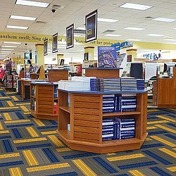 A room with a large stack of books on shelves.