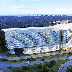 A large building with a parking lot.