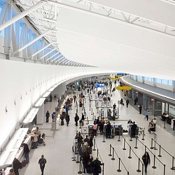A group of people walking in a large building.