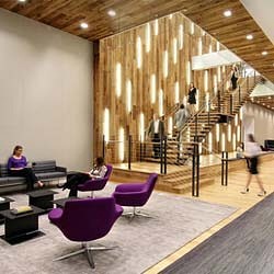 A room with people and chairs.