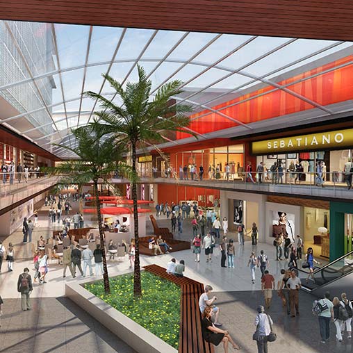 A mall with people and shopping carts.