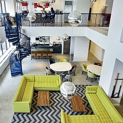 A room with tables and chairs.