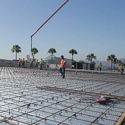A person walking on a brick walkway.
