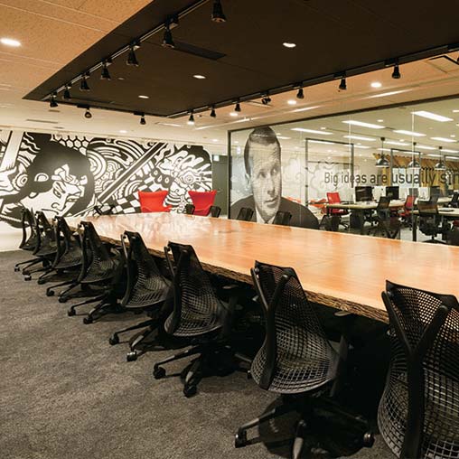 A conference room with a large table.