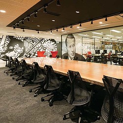 A conference room with a large table.