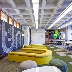 A room with tables and chairs.