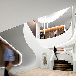 A staircase with a person walking up to it.