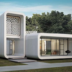 A white building with a glass door.