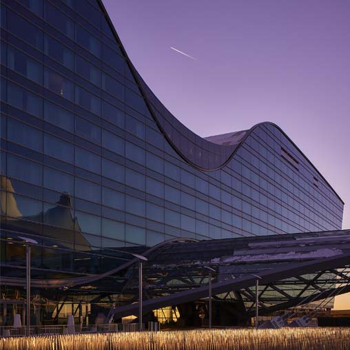 A building with a bridge in front.