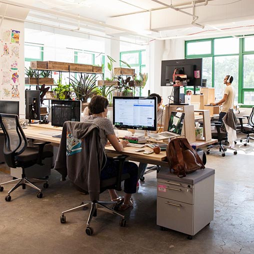 A person sitting at a desk with a computer.
