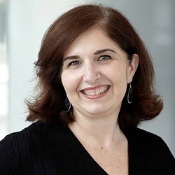 A close-up of a woman smiling.