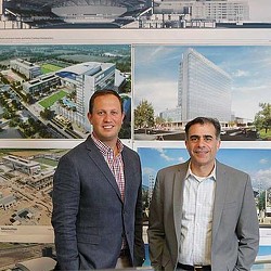 A couple of men posing for the camera.