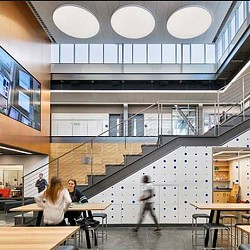 People sitting at tables in a building.