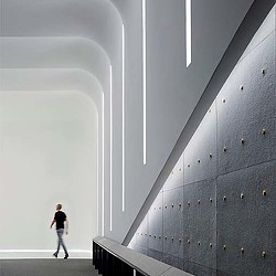 A person walking down a hall.