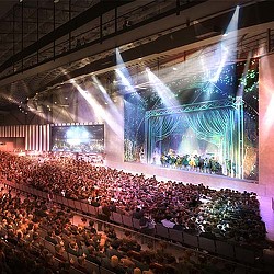 A stage with a crowd of people.