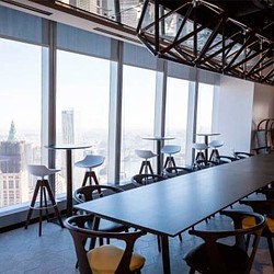 A room with tables and chairs.