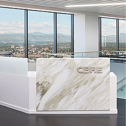 A room with windows and a view of a city.