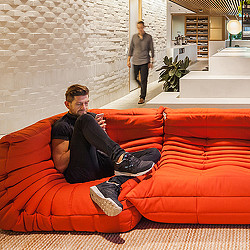 A person sitting on a couch.