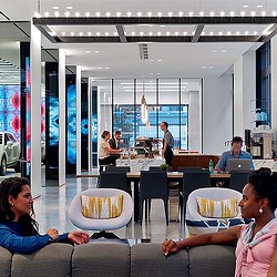 A group of people sitting at tables.
